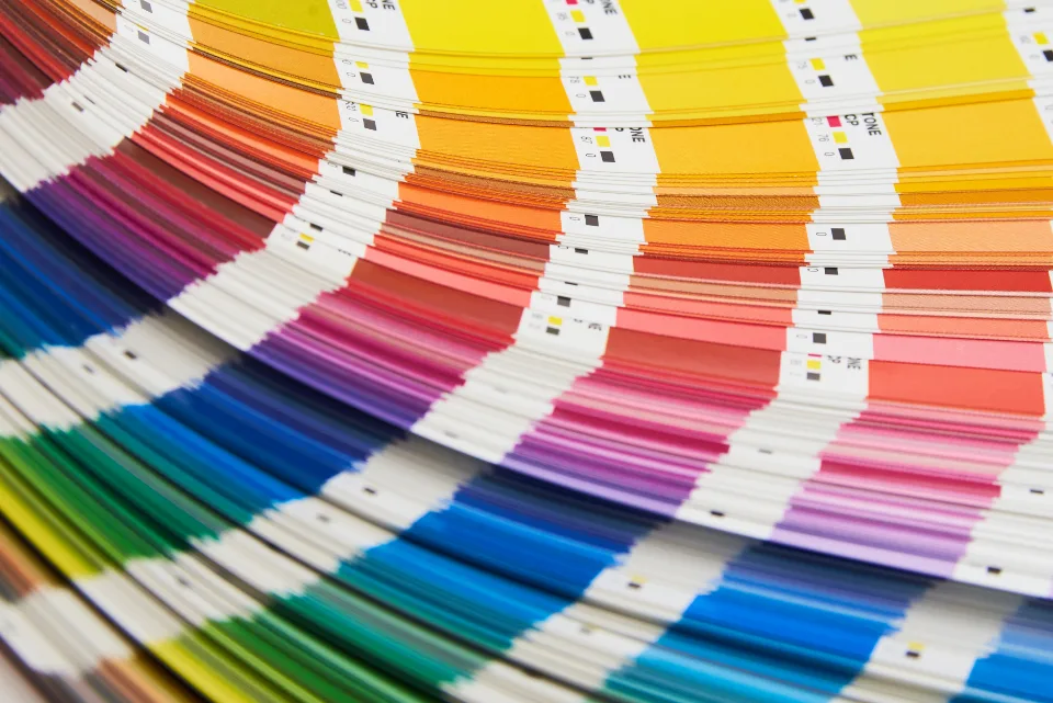 Fanned-out color swatch guide showing a full spectrum of printed color samples