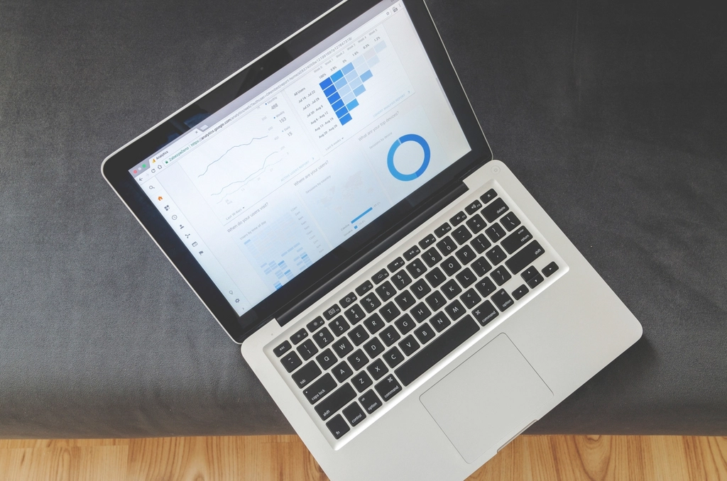 Open laptop displaying analytics charts on a desk